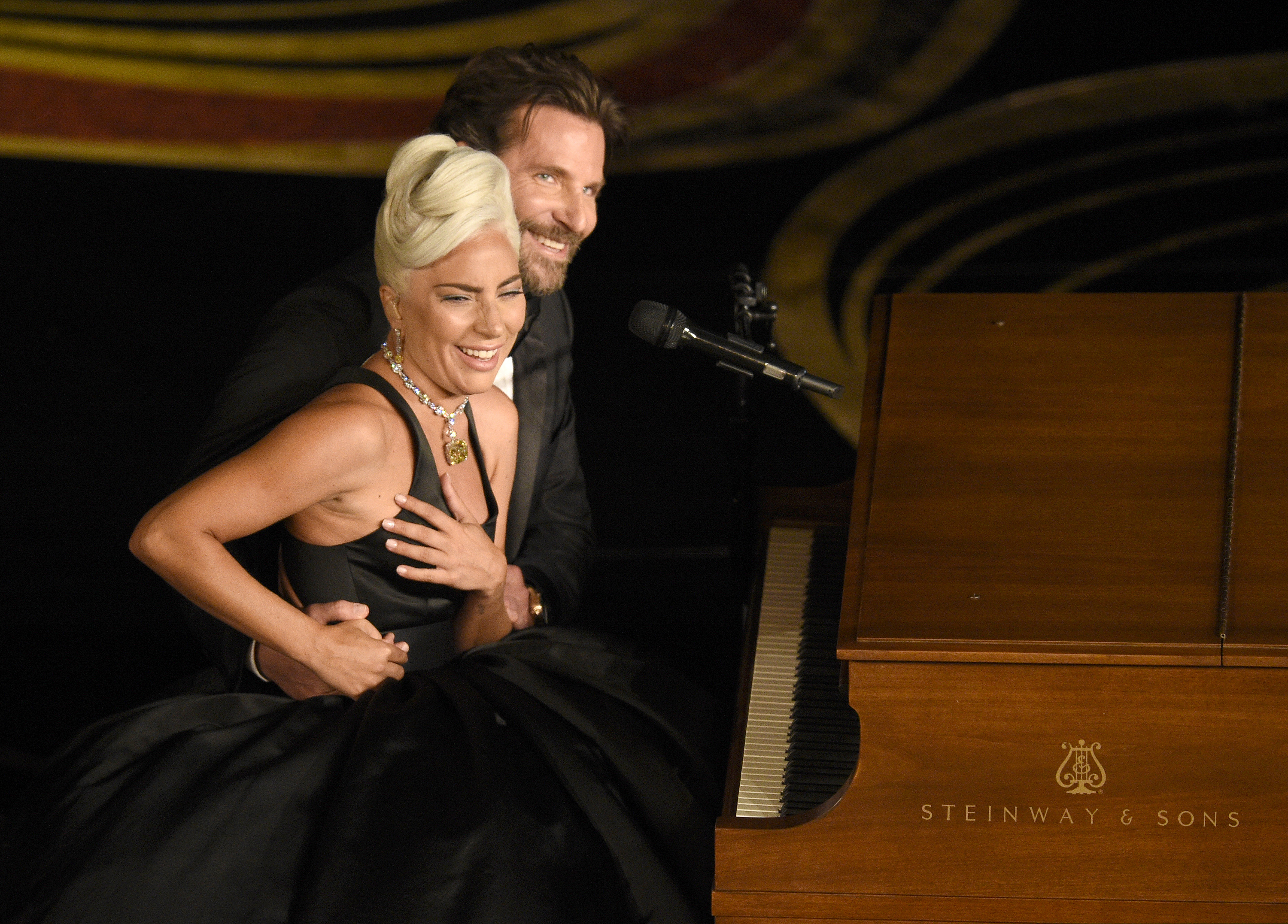 Lady Gaga, left, and Bradley Cooper react to the audience after a performance of "Shallow" from "A Star is Born" at the Oscars on Sunday, Feb. 24, 2019, at the Dolby Theatre in Los Angeles. (Photo by Chris Pizzello/Invision/AP)