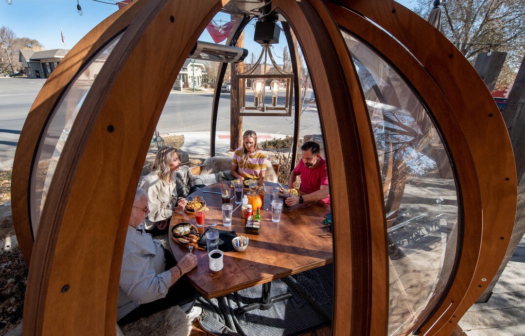 (Francisco Kjolseth  |  The Salt Lake Tribune) Customers enjoy breakfast inside the dome-like Alpenglobes that allow diners to eat inside a warm environment, while also being separated from others at Cafe Galleria in Midway on Thursday, Nov. 5, 2020. The owners were trying to find a way to use their outdoor patio in the winter, teaming up with Insight Exhibit, a Salt Lake City corporate event company that was looking for a way to make money while large gatherings have been cancelled.