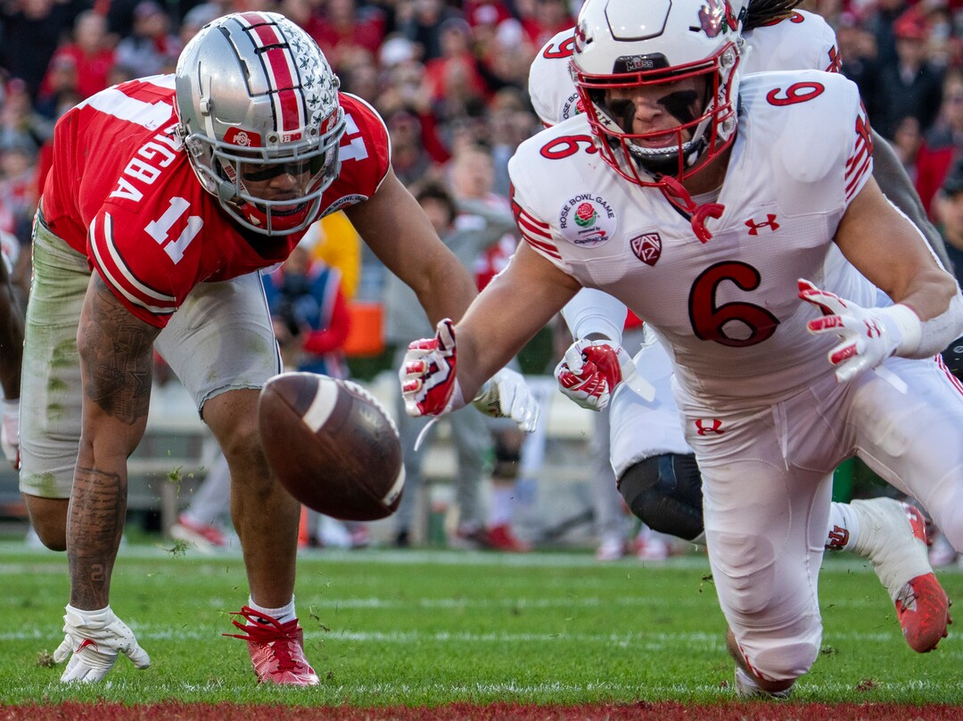(Rick Egan | The Salt Lake Tribune)  Ohio State Buckeyes wide receiver Jaxon Smith-Njigba (11) tries to recover his fumble as Utah Utes running back Ricky Parks (6) dives for the ball to get possession for Utah, in football action between Utah Utes and Ohio State Buckeyes in the Rose Bowl in Pasadena, CA, on Saturday, January 1, 2022.