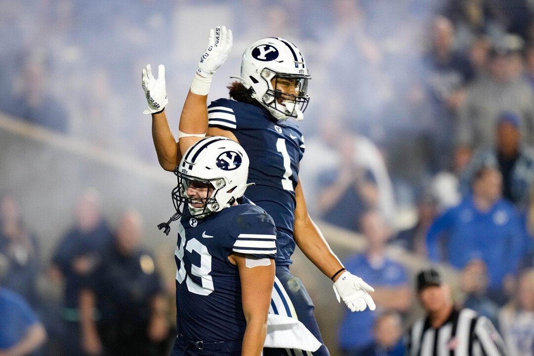 (Francisco Kjolseth | The Salt Lake Tribune) Brigham Young Cougars tight end Isaac Rex (83) and Brigham Young Cougars wide receiver Keanu Hill (1) celebrate a touchdown in football action between the Brigham Young Cougars and the Wyoming Cowboys at LaVell Edwards Stadium in Provo, on Saturday, Sept. 24, 2022.