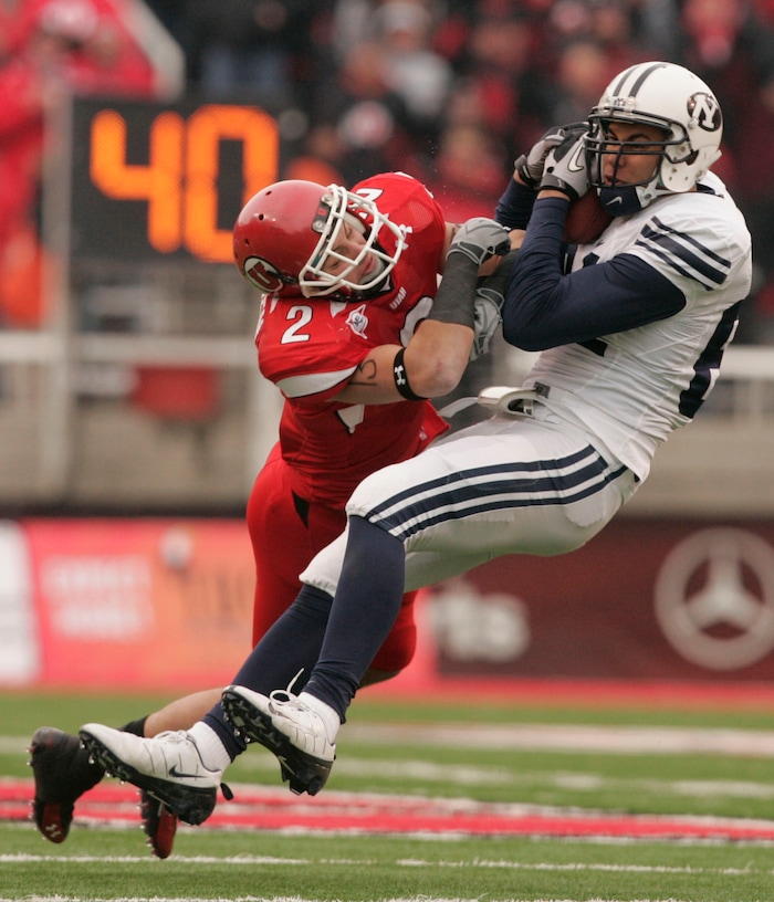 (Trent Nelson  |  Tribune file photo)  Utah Utes cornerback Brian Blechen #2 hits BYU tight end Devin Mahina (84) as the Utes face BYU in the second quarter at Rice-Eccles Stadium Saturday, November 27, 2010.