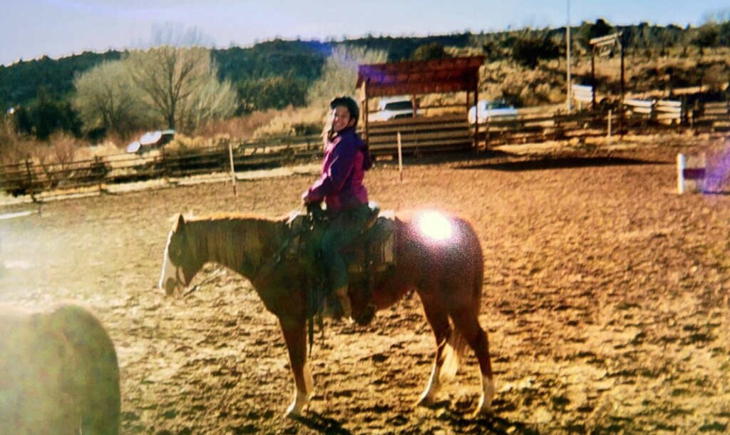 (Courtesy Hannah Archuleta) This 2019 photo shows Hannah Archuleta riding a horse while at Turn-About Ranch in Escalante, Utah. Archuleta's attorney, Gloria Allred, said the girl was instructed to smile because the photo would be sent to her parents and she "needed to look happy." Archuleta is now suing Turn-About Ranch after she says she was sexually assaulted by a staffer.