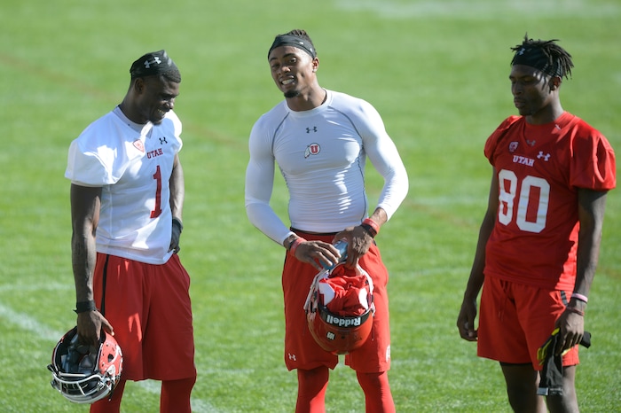 Scott Sommerdorf | The Salt Lake Tribune
Utah QB Tyler Huntley, left, and WR Siaosi Wilson, right, talk with new Utah WR Darren Carrington II after the first day of Utah fall football camp, Friday, July 28, 2017. during the first day of Utah fall football camp, Friday, July 28, 2017.