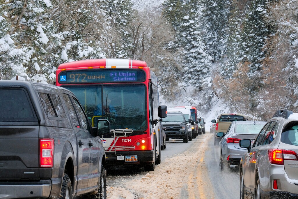 (Leah Hogsten | The Salt Lake Tribune)  Unified Police Department officers held up canyon traffic for a hour and a half as avalanche mitigation efforts were underway at Carter Fork, Mineral Slab and Rock House areas of Big Cottonwood Canyon, Feb 16, 2021.