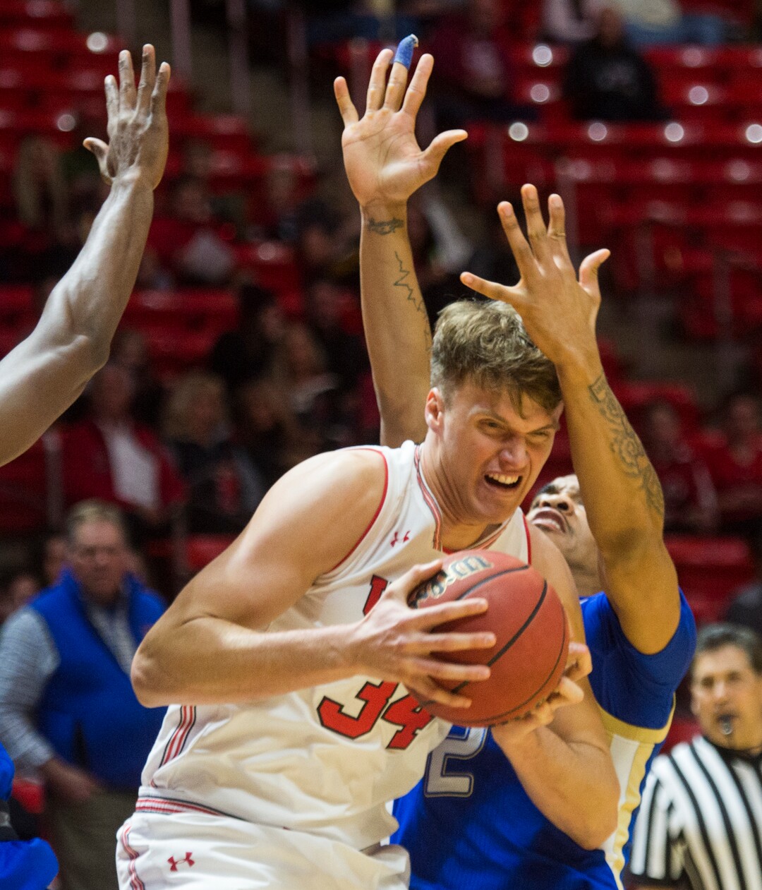 (Rick Egan  |  The Salt Lake Tribune)    Utah Utes center Jayce Johnson (34) tries to get a shot as Tulsa forward Martins Igbanu (1) and Tulsa guard DaQuan Jeffries (2) defend for the Golden Hurricane's,  in basketball action between, Utah Utes and Tulsa Golden Hurricane, at the Jon M. Huntsman Center, Saturday, Dec. 1, 2018.