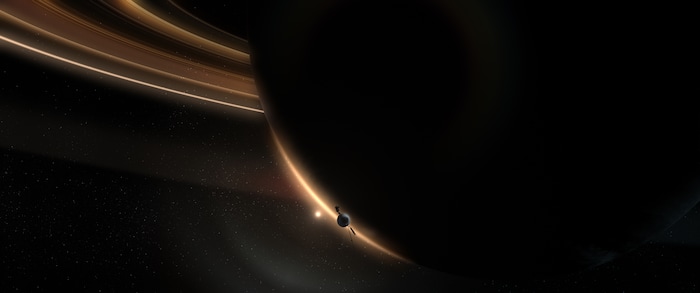 (Credit: Courtesy of Tangled Bank Studios) This CGI image shows Voyager flying toward the dark side if Saturn.