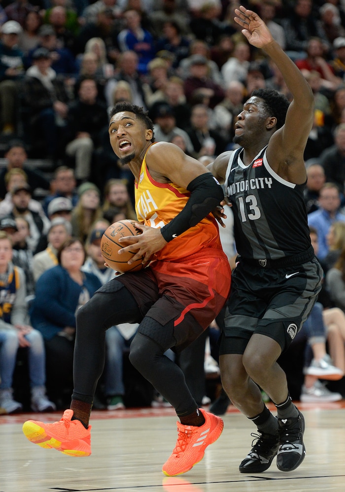 (Francisco Kjolseth  |  The Salt Lake Tribune)  Utah Jazz guard Donovan Mitchell (45) pushes past Detroit Pistons guard Khyri Thomas (13) in the first half of their NBA game at Vivint Smart Home Arena Monday, Jan. 14, 2019, in Salt Lake City.