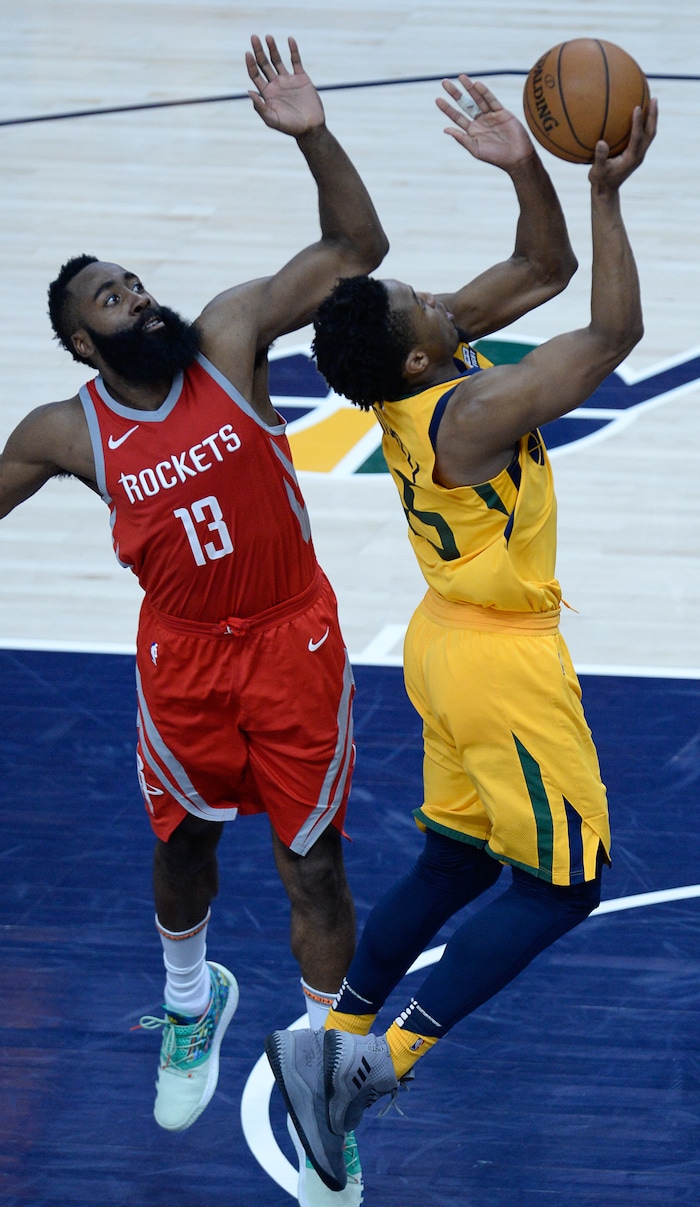 (Francisco Kjolseth | The Salt Lake Tribune) Utah Jazz guard Donovan Mitchell (45) moves past Houston Rockets guard James Harden (13) in the final minutes of Game 4 of the NBA playoffs at the Vivint Smart Home Arena Sunday, May 6, 2018 in Salt Lake City. Houston took a 3-1 series lead over the Jazz with a final score of 100 to 87.