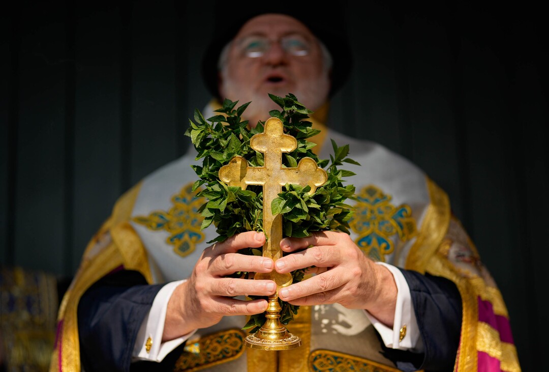 (Francisco Kjolseth  |  The Salt Lake Tribune) Archbishop Elpidophoros of America performs opening ceremonies for St. Anna Greek Orthodox Church in Sandy on Saturday, July 13, 2024, as he holds basil grown at the church that is traditional in special servies. 