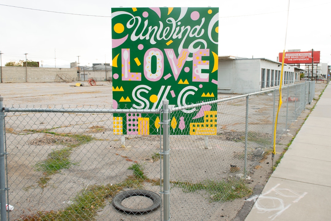 (Jeremy Harmon  |  The Salt Lake Tribune) A colorful sign alludes to things to come as developers plan to remake a 12.4-acre area just west of downtown Salt Lake City. The development, called Post District, is mostly comprised of the block between 300 and 400 West and 500 and 600 South. Photographed on Thursday, Oct. 17, 2019.