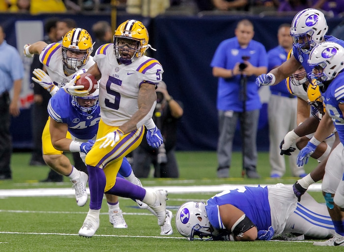 LSU running back Derrius Guice (5) breaks into the open against BYU during the second half of an NCAA college football game in New Orleans, Saturday, Sept. 2, 2017. (AP Photo/Scott Threlkeld)