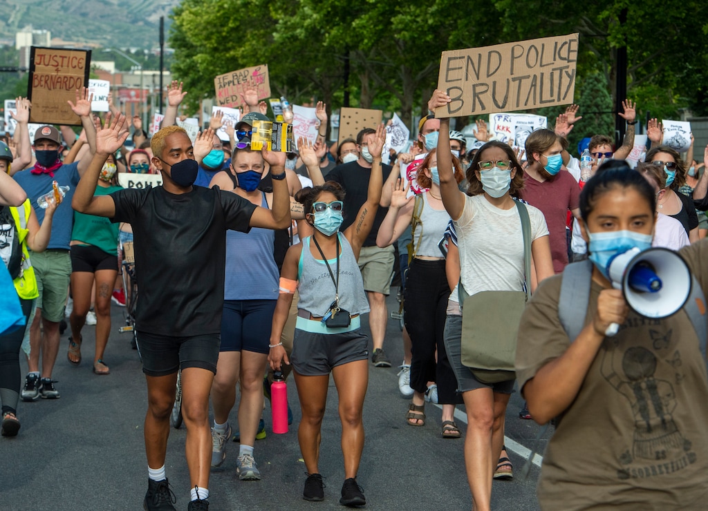 (Rick Egan  |  Tribune file photo)     Protesters shout "hands up don't shoot" as they march down the street in Salt Lake City, during a Justice for Bernardo rally on Thursday, June 25, 2020.