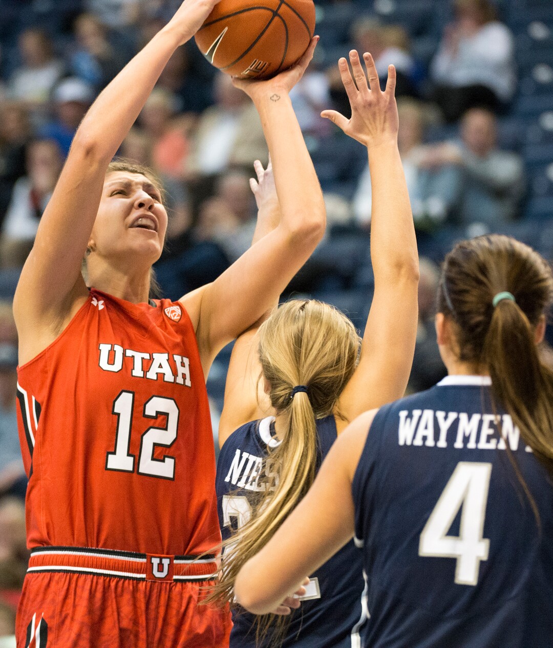Rick Egan  |  The Salt Lake TribuneUtah Utes forward Emily Potter (12) shoots over Brigham Young Cougars forward Amanda Wayment (4), in basketball action, BYU vs. Utah, in the Marriott Center, Saturday, December 12, 2015.