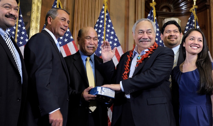 In this Jan. 5, 2011 file photo, House Speaker John Boehner, second left, of Ohio participates in a ceremonial House swearing-in ceremony for Del. Eni H. Faleomavaega, third from right, D-American Samoa, on Capitol Hill in Washington. American Samoa’s longest serving non-voting delegate to the U.S House of Representatives Faleomavaega died Wednesday, Feb. 22, 2017, at age 73. His sister-in-law, Therese Hunkin, didn’t disclose the cause of death but said he died at his home in Provo, Utah.  (AP Photo/Susan Walsh, File)