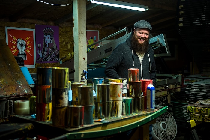 (Chris Detrick | The Salt Lake Tribune) Artist Travis Bone poses for a portrait in his workshop in Midvale Tuesday, November 28, 2017.