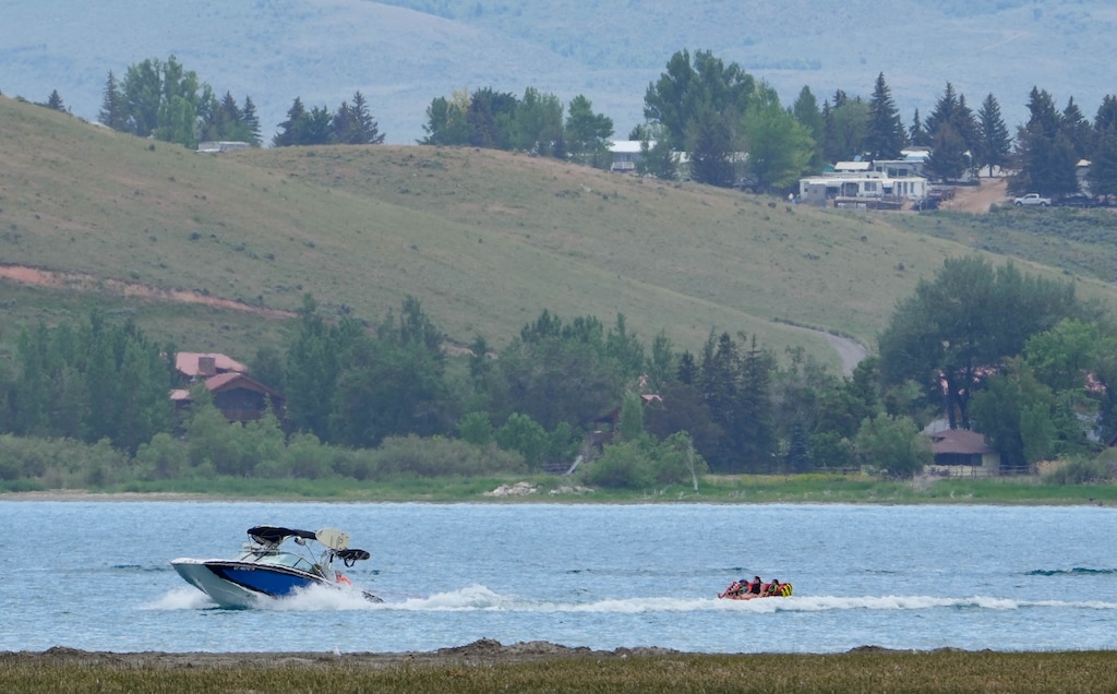 (Francisco Kjolseth | The Salt Lake Tribune) People recreate in the clear blue waters of Bear Lake on Thursday, June 30, 2022. A new study is out showing the economic contributions of Bear Lake, underscoring the need to keep the lake healthy.