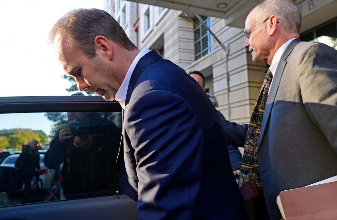 Rick Gates, left, gets into a car as he leaves federal court in Washington, Monday, Oct. 30, 2017. Paul Manafort, President Donald Trump's former campaign chairman, and Manafort's business associate Gates pleaded not guilty to felony charges of conspiracy against the United States and other counts. (AP Photo/Susan Walsh)