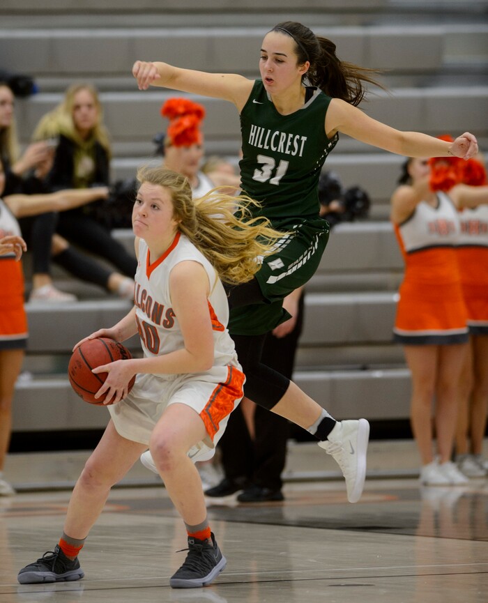 (Steve Griffin  |  The Salt Lake Tribune)  Skyridge's Brooklynn Lundell keeps the ball away from Hillcrest's Annabella Jensen during game at Skyridge High School in Lehi Wednesday December 13, 2017.