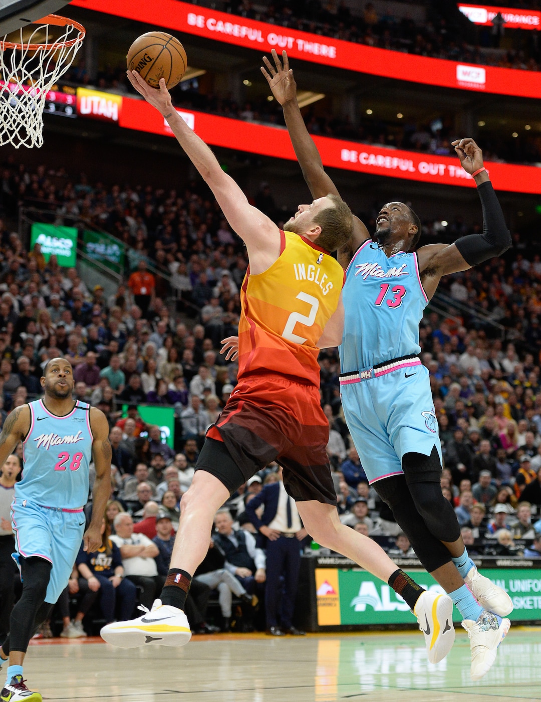 (Francisco Kjolseth  |  The Salt Lake Tribune) Utah Jazz guard Joe Ingles (2) stretches out for a shot against Miami Heat forward Bam Adebayo (13) as the Utah Jazz host the Miami Heat in their NBA basketball game at Vivint Smart Home Arena in Salt Lake City on Wednesday, Feb. 12, 2020.