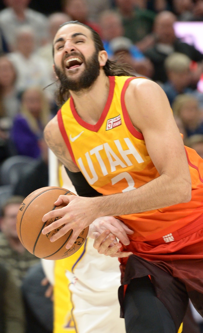 (Leah Hogsten  |  The Salt Lake Tribune)  Utah Jazz guard Ricky Rubio (3) is fouled by Los Angeles Lakers guard Alex Caruso (4) as the Utah Jazz host the Los Angeles Lakers at Vivint Smart Home Arena Tuesday, April 3, 2018.

