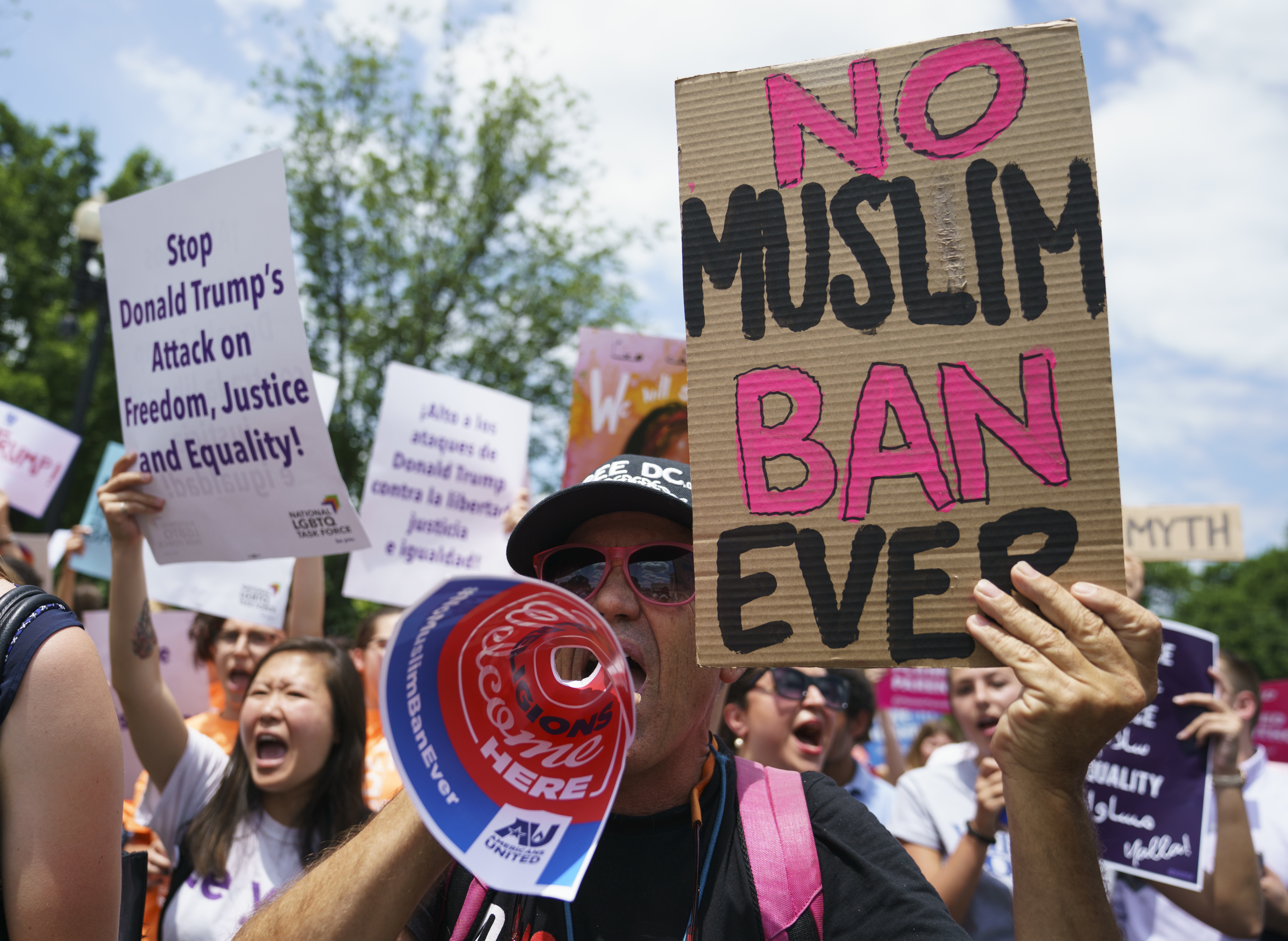 (Carolyn Kaster | AP file photo) File) Protesters call out against the Supreme Court ruling upholding President Donald Trump's travel ban outside the Supreme Court on June 26, 2018. The ban stops most visas for residents of mostly Muslim Libya, Iran, Somalia, Syria and Yemen.