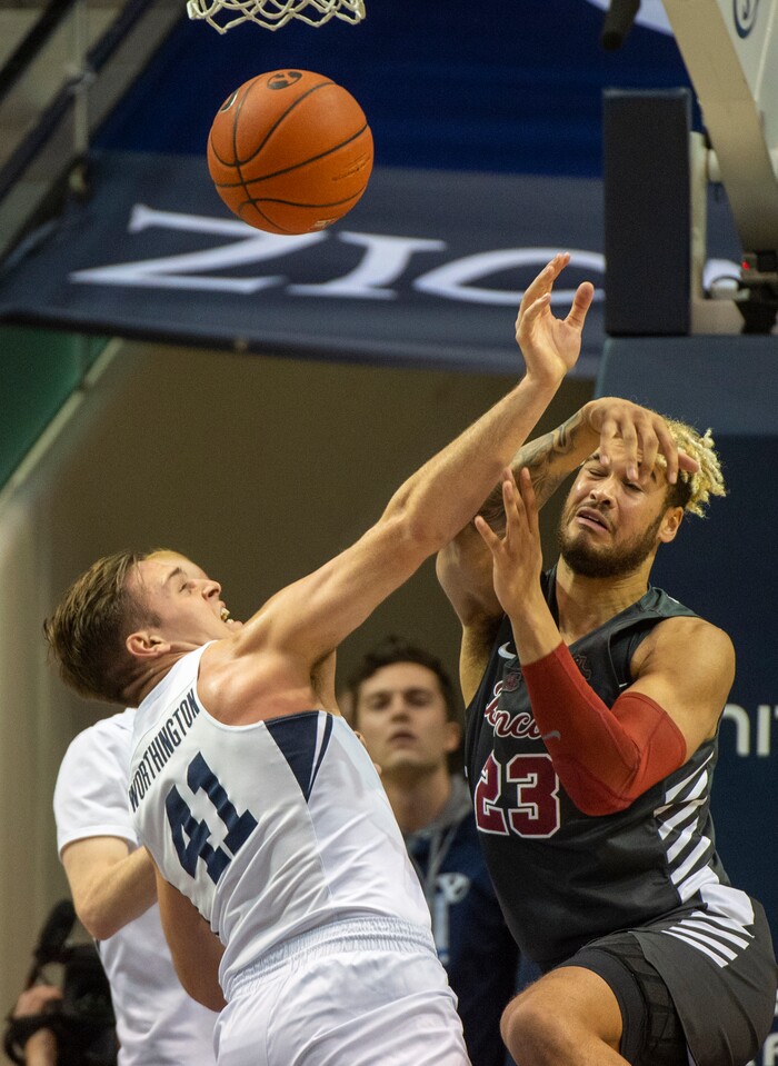 (Rick Egan  |  The Salt Lake Tribune)       Brigham Young Cougars forward Luke Worthington (41) goes for a rebound song with Santa Clara Broncos center Ezekiel Richards (23), in basketball action between Brigham Young Cougars and Santa Clara Broncos at the Marriott Center in Provo, Saturday, Jan. 12, 2019.


