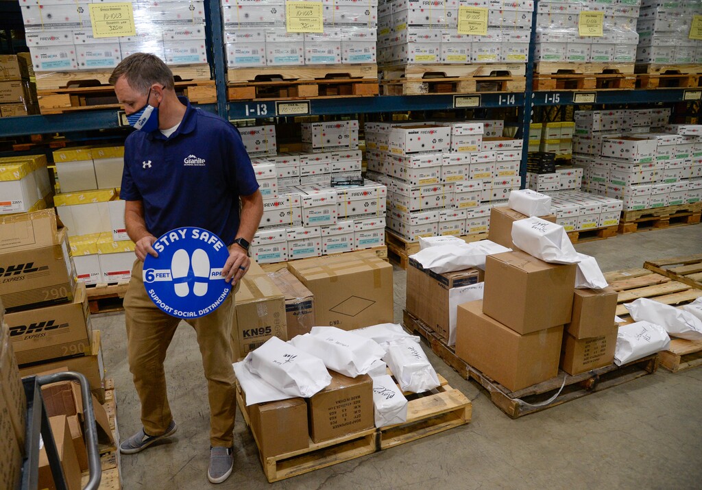 (Francisco Kjolseth  |  Tribune file photo) Granite School District communications director Ben Horsley overlooks PPE inventory being prepared to ship to schools for the start of classes next week from the Granite School District Warehouse on Tuesday, August 18, 2020.