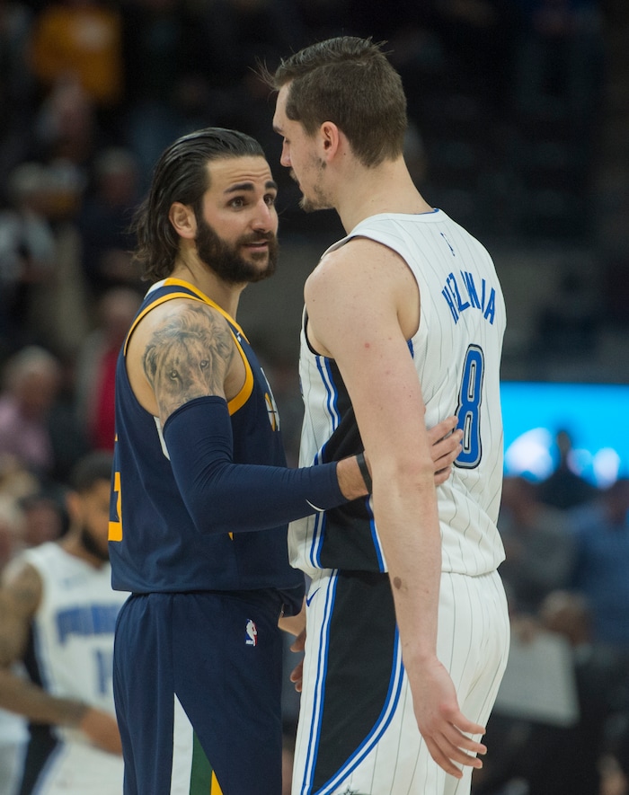 (Rick Egan  |  The Salt Lake Tribune)      Utah Jazz guard Ricky Rubio (3) hugs Orlando Magic forward Mario Hezonja (8) after the game between the Utah Jazz and the Orlando Magic,  Monday, March 5, 2018.



