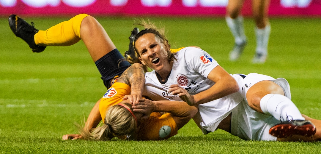 (Rick Egan  |  The Salt Lake Tribune)    Utah Royals FC midfielder Gunnhildur Jónsdóttir (66) collides with Portland Thorns FC defender Katherine Reynolds (2), in Soccer action between Utah Royals FC and Portland Thorns FC, in Sandy, Friday, July 19, 2019.