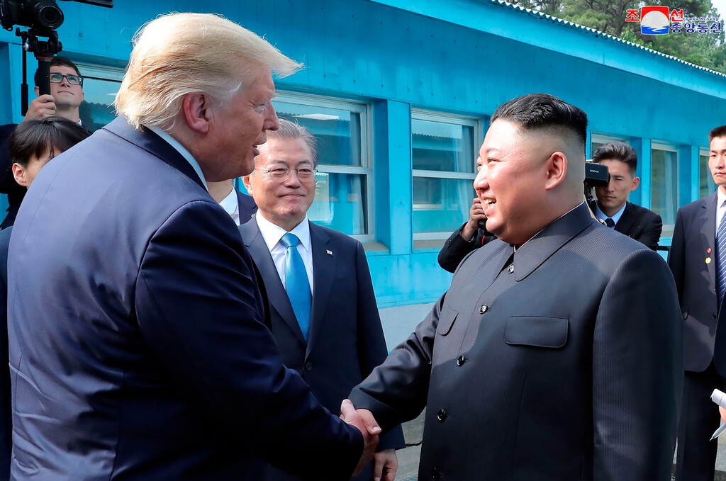 (Korean Central News Agency/Korea News Service via AP) In this Sunday, June 30, 2019, photo provided by the North Korean government, North Korean leader Kim Jong Un, right, bids farewell to U.S. President Donald Trump, left, and South Korean President Moon Jae-in, at the border village of Panmunjom in Demilitarized Zone. The content of this image is as provided and cannot be independently verified. Korean language watermark on image as provided by source reads: "KCNA" which is the abbreviation for Korean Central News Agency.