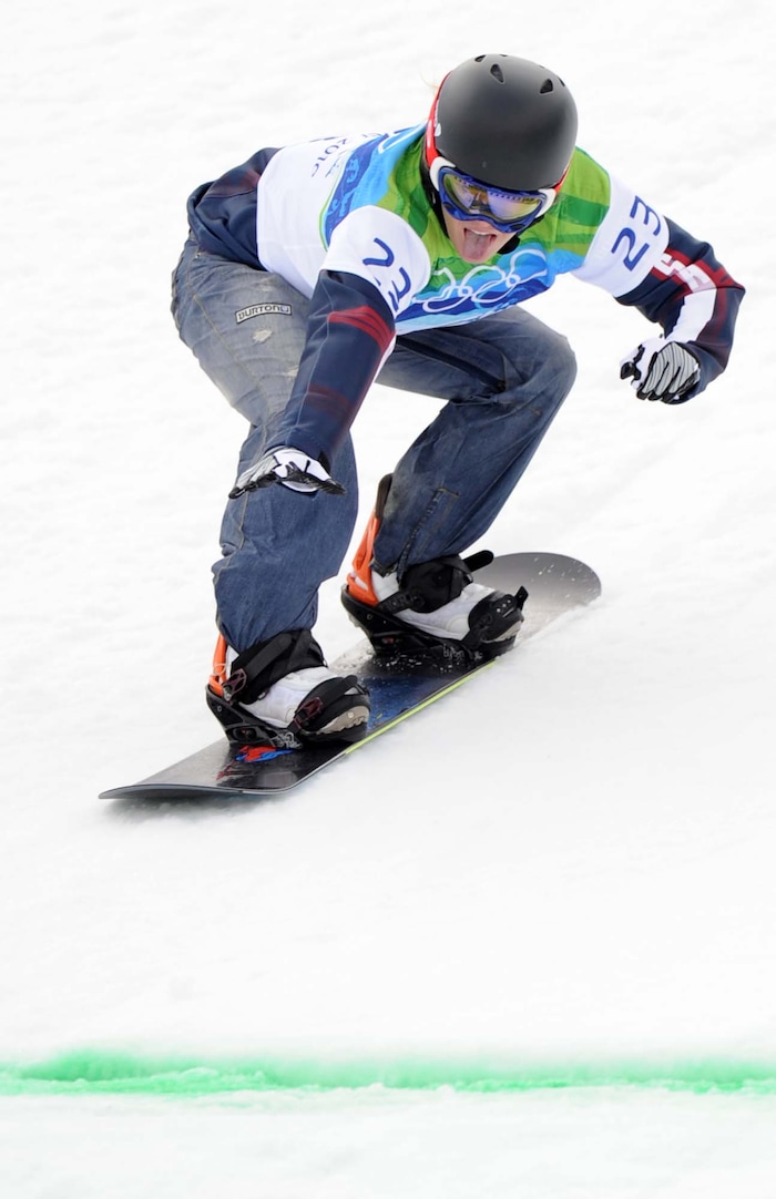 (Trent Nelson  |  Tribune File Photo)  Faye Gulini slides to the finish line during a snowboardcross qualifying run at the 2010 Vancouver Olympics.