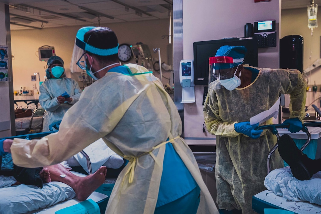 (Michael Kirby Smith/The New York Times) Doctors in the emergency room at the Jack D. Weiler Hospital in the Bronx, on April 8, 2020. “If people saw this, they would stay home.” What the war against the coronavirus looks like inside two Bronx hospitals.