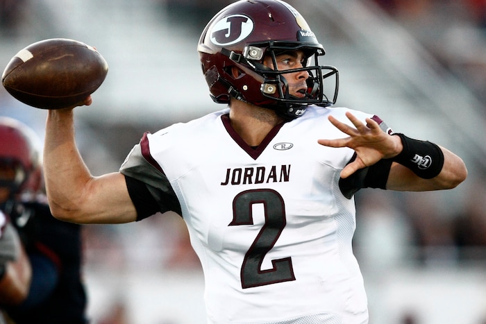 (Chris Detrick  |  The Salt Lake Tribune)  Jordan's Austin Kafentzis (2) looks to pass the ball during the game at Herriman High School Friday September 20, 2013.