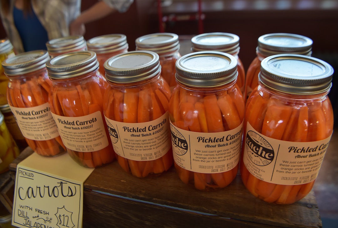 (Scott Sommerdorf   |  The Salt Lake Tribune)   Pickled carrots for sale at the Cache Canning Company booth at the Rio Grande Winter Market, Saturday, November 11, 2017. 