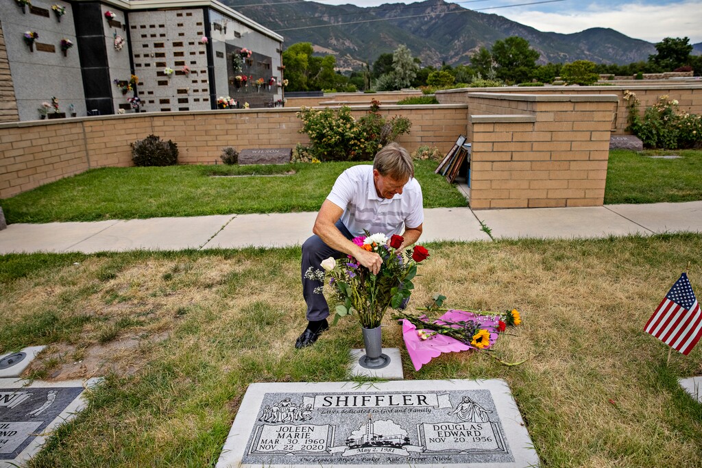 (Kim Raff | The New York Times) Doug Shiffler visits his wife's grave in Ogden, Utah, July 14, 2022. Shiffler is one of hundreds of people suing Philips Respironics after his wife died of lung cancer with in a year of diagnosis.