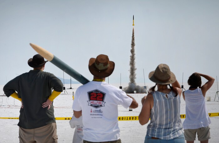(Scott Sommerdorf   |  The Salt Lake Tribune)   Spectators watch rockets launch on the Bonneville Salt Flats during "HellFire" — the event sponsored by the Utah Rocket Club on Saturday, Aug. 5, 2017.