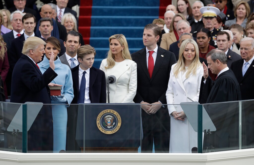 FILE - In this Jan. 20, 2017 file photo, Donald Trump, left, is sworn in as the 45th president of the United States by Chief Justice John Roberts, right, as Melania Trump, second left, and his family watch during the 58th Presidential Inauguration at the U.S. Capitol in Washington. A federal subpoena seeking documents from Donald Trump's inaugural committee is part of "a hysteria" over the fact that he's president, White House press secretary Sarah Sanders said on Tuesday, Feb. 5, 2019. Federal prosecutors in New York issued the subpoena on Monday, furthering a federal inquiry into a fund that has faced mounting scrutiny into how it raised and spent its money. (AP Photo/Patrick Semansky, File)
