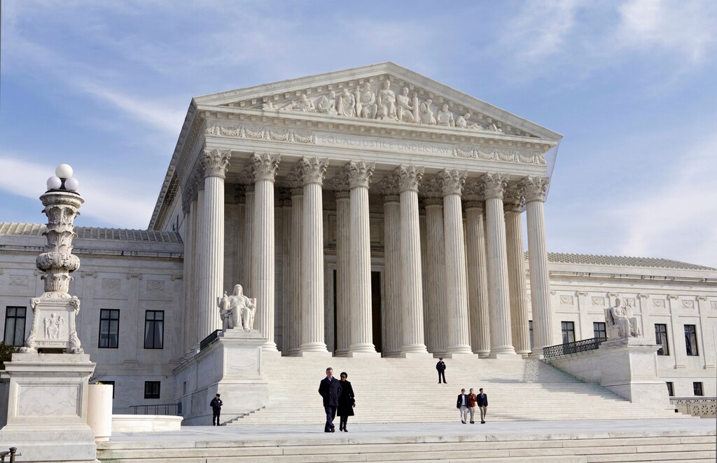 FILE - This Jan. 25, 2012, file photo, shows the U.S. Supreme Court Building in Washington. The Supreme Court enters its final week of work before a long summer hiatus with action expected on the Trump administration’s travel ban and a decision due in a separation of church and state case that arises from a Missouri church playground. (AP Photo/J. Scott Applewhite, File)