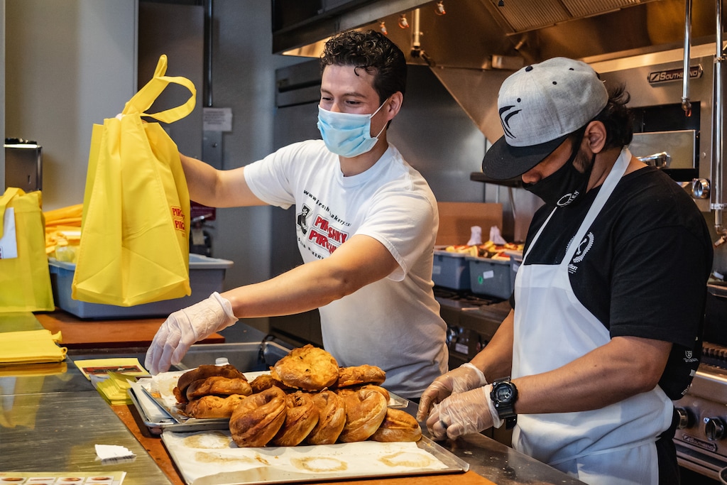 (Courtesy Piroshky Piroshky) Bakers make hand pies at Piroshky Piroshky in Seattle's Pike Place Market. The shop is marking its 30th anniversary by holding pop-up events across the country — including two in Utah in June.