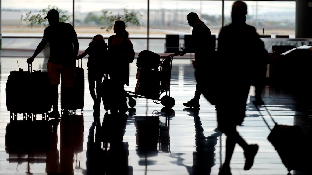 (Rick Bowmer | AP) Travelers are shown at Salt Lake City International Airport Monday, June 13, 2022, in Salt Lake City.