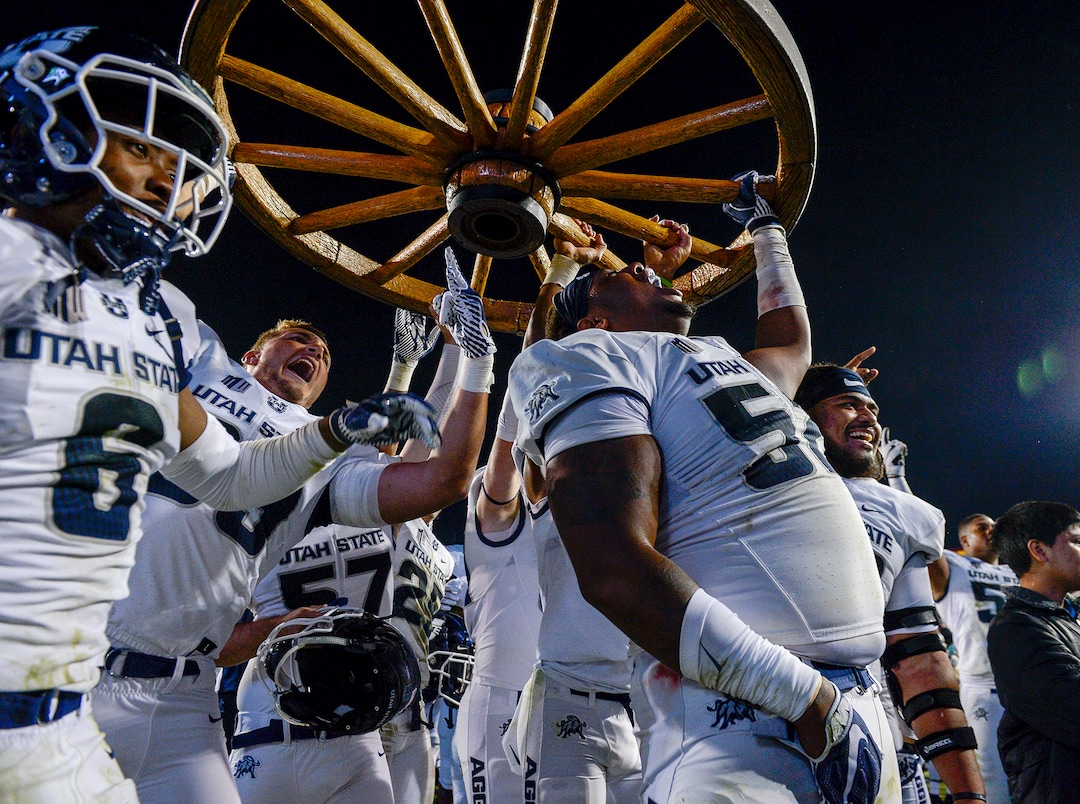 Leah Hogsten  |  The Salt Lake Tribune   Utah State Aggies celebrate the win after defeating BYU, 45-20, at Lavell Edwards Stadium in Provo, Friday, Oct. 5, 2018.