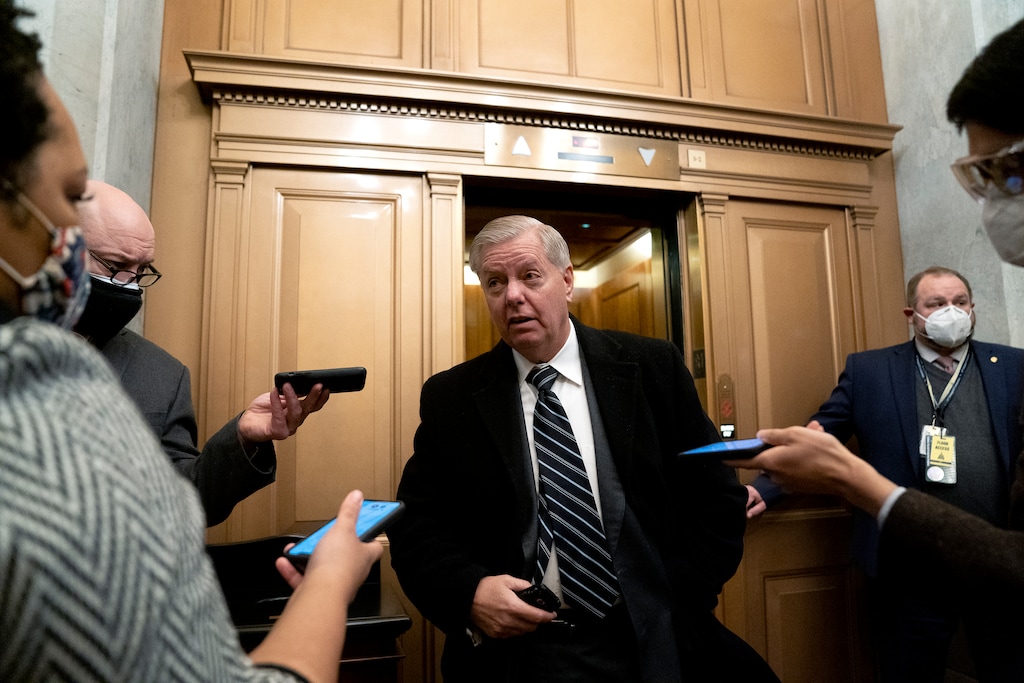 (Stefani Reynolds/Pool via AP) Sen. Lindsey Graham, R-S.C., speaks to reporters at the Capitol in Washington on Feb. 13, 2021.