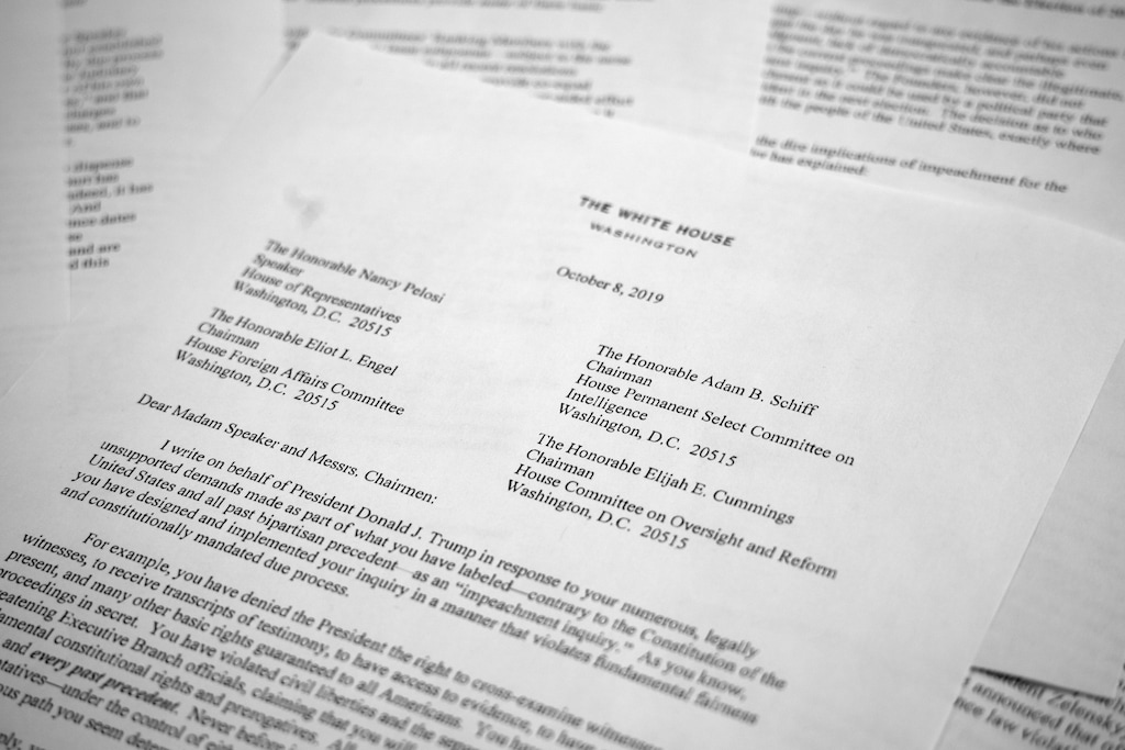 A letter from White House counsel Pat Cipollone is photographed in Washington, on Tuesday, Oct. 8, 2019. The White House declared it will not cooperate with what it termed the "illegitimate" impeachment probe by House Democrats, sharpening the constitutional clash between President Donald Trump and Congress. Trump attorneys sent a letter to House leaders bluntly stating their refusal to participate in the quickly moving impeachment investigation. (AP Photo/Jon Elswick)