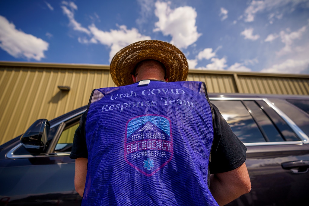 (Trent Nelson  |  The Salt Lake Tribune) Spencer Lowe administers a dose of the Pfizer COVID-19 vaccine at a drive-thru event organized by the Utah County Health Department in Spanish Fork on Friday, Sept. 10, 2021.