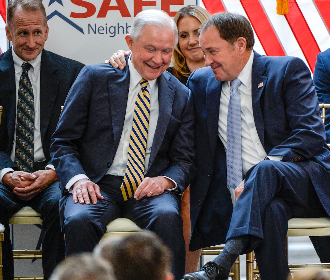 Leah Hogsten  |  The Salt Lake Tribune   l-r U.S. Attorney General Jeff Sessions and Utah Governor Gary Herbert share a laugh during the commemoration ceremony. Sessions touted the nation's Project Safe Neighborhoods, Wednesday, October 3, 2018, at the Utah Capitol, on the one year anniversary since the Trump administration returned to the policy pushed by the George W. Bush administration. Under Project Safe Neighborhoods, federal prosecutors focus on security stiff sentences for those convicted of gun crimes and reducing violent crimes.