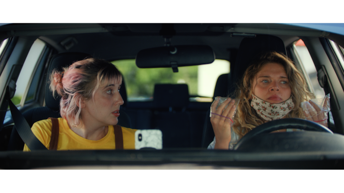 (Decal) Jamie (Whitney Call, left) and Blake (Mallory Everton) are sisters on a road trip during the early days of the COVID-19 pandemic, in the comedy "Stop and Go," which Call and Everton wrote, and Everton and Stephen Meek (Call's husband) directed.