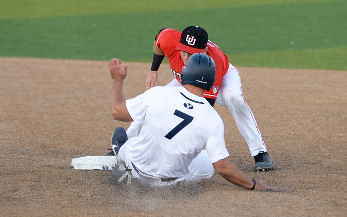 (Leah Hogsten  |  The Salt Lake Tribune) BYU's Kyle Dean  is outed at second by Utah's Oliver Dunn in the 4th inning as Brigham Young University hosts University of Utah at Miller Park, Tuesday, April 24, 2018 in Provo.