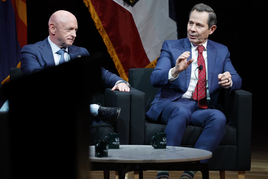 (August Miller | UVU Marketing) Sen. Mark Kelly, D-Ariz., and Sen. John Curtis speak during a town hall at Utah Valley University in Orem on Wednesday, Nov. 12, 2025.