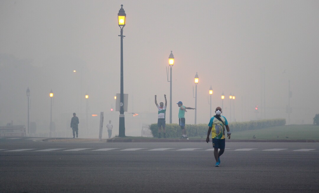 Morning walkers exercise amidst smog due to firecrackers burnt in Thursday's Diwali festival, in New Delhi, India, Friday, Oct. 20, 2017. Environmental pollution - from filthy air to contaminated water - is killing more people every year than all war and violence in the world. One out of every six premature deaths in the world in 2015 - about 9 million - could be attributed to disease from toxic exposure, according to a major study released Thursday, Oct. 19, 2017 in The Lancet medical journal. (AP Photo/Manish Swarup)