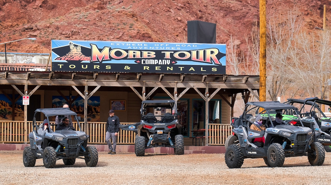 (Leah Hogsten | The Salt Lake Tribune) Thrill seekers driving off-road utility terrain vehicles (UTVs) rented from Moab Tour Company head out of the parking lot on Main Street to head towards the Sand Flats Recreation Area trail, located just 4 miles outside of town, Feb. 19, 2021.